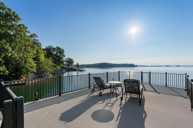 wooden deck with a water view