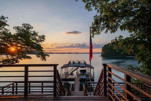 view of dock with a water view and boat lift