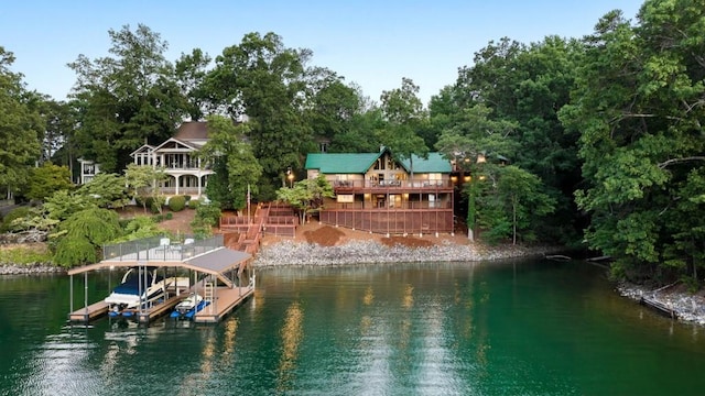 dock area featuring boat lift and a water view