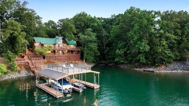 view of dock featuring a water view and boat lift