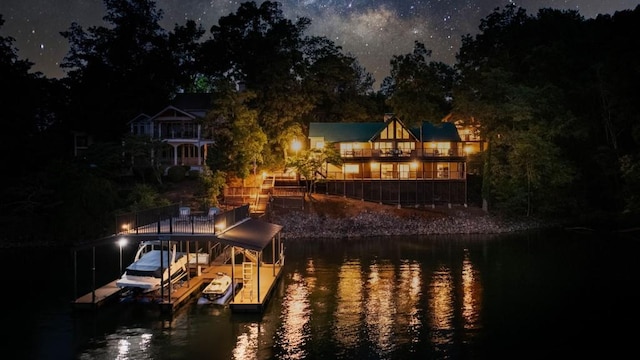 view of dock with a water view and boat lift