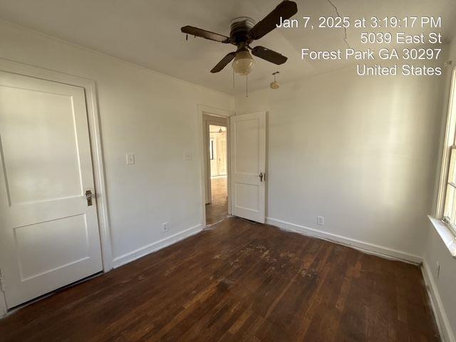 unfurnished bedroom with ceiling fan, baseboards, and wood finished floors