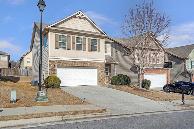 view of front of home with a garage and central AC unit