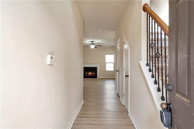 hall with light hardwood / wood-style flooring