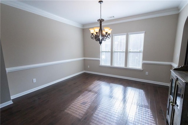 unfurnished dining area featuring crown molding, a chandelier, and dark hardwood / wood-style floors