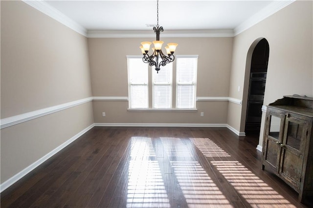 unfurnished dining area with a notable chandelier, crown molding, and dark hardwood / wood-style flooring