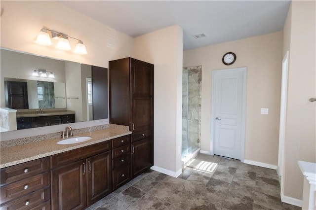 bathroom with vanity and walk in shower