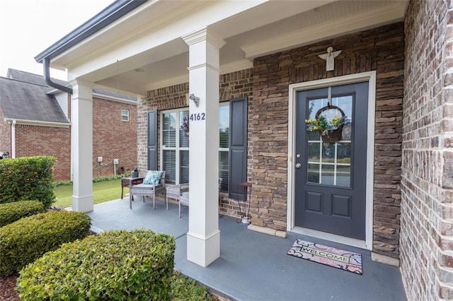 property entrance featuring a porch