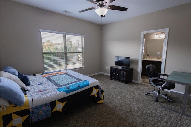 bedroom featuring ceiling fan, connected bathroom, and carpet floors