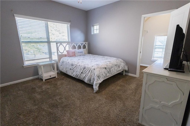 bedroom featuring dark carpet