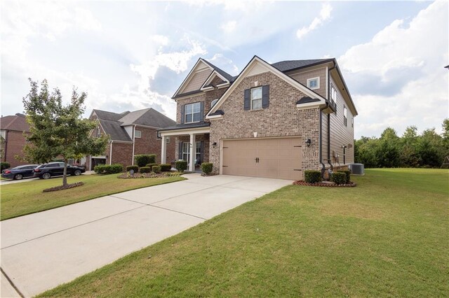 craftsman house featuring central AC, a front lawn, and a garage