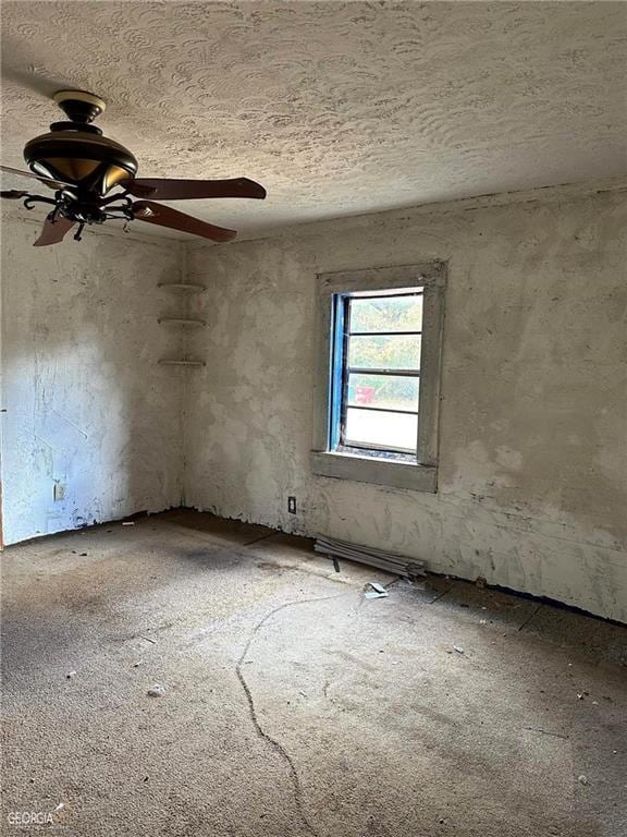 spare room featuring a ceiling fan