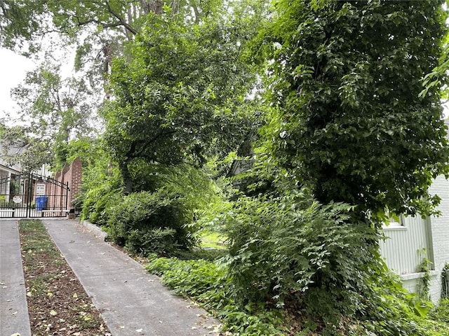 surrounding community featuring a gate and fence