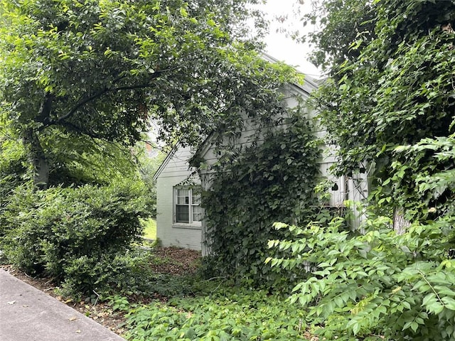view of side of home with brick siding