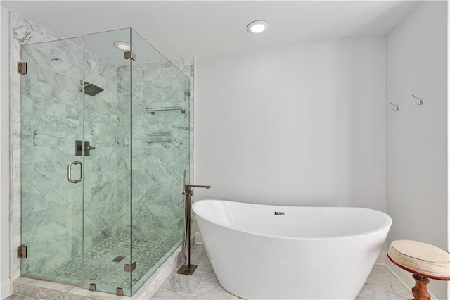 3475 Oak Valley Rd Unit 130, Atlanta, GA 30326 - full bath featuring a shower stall, baseboards, a freestanding tub, and recessed lighting