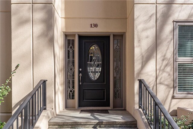 3475 Oak Valley Rd Unit 130, Atlanta, GA 30326 - doorway to property featuring stucco siding