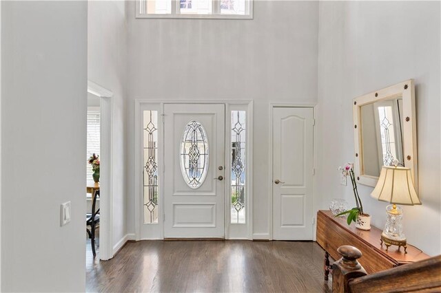 3475 Oak Valley Rd Unit 130, Atlanta, GA 30326 - entrance foyer with a healthy amount of sunlight, wood finished floors, and a towering ceiling
