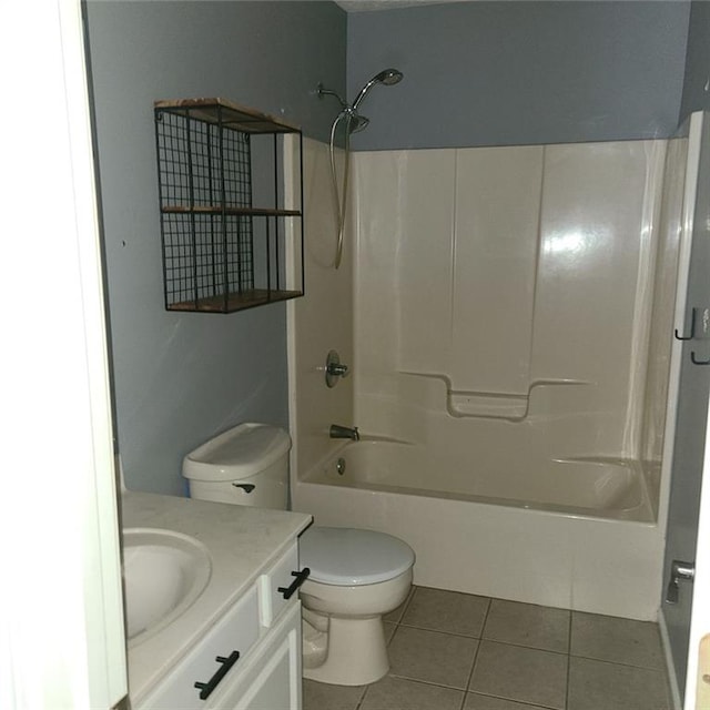 full bathroom featuring vanity, toilet, tile patterned floors, and shower / bathtub combination