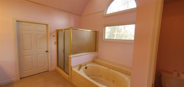 bathroom with toilet, vaulted ceiling, a shower stall, a tub with jets, and tile patterned floors