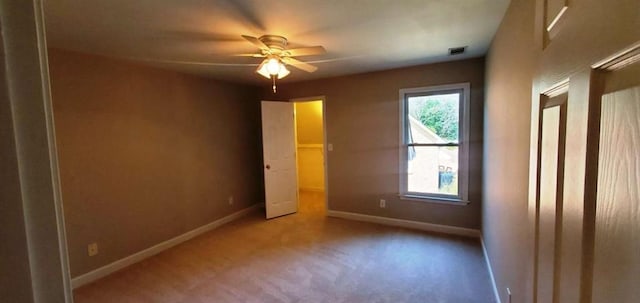 unfurnished bedroom featuring baseboards, visible vents, and a ceiling fan