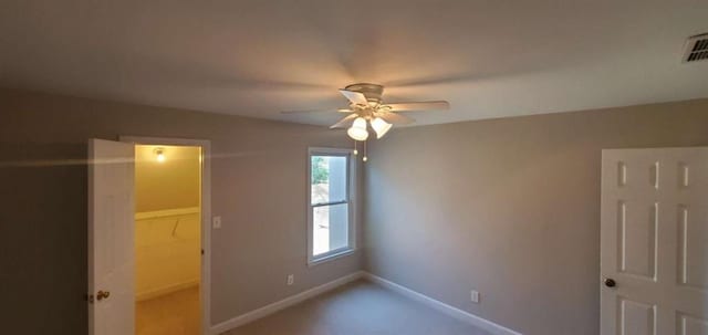 unfurnished bedroom featuring ceiling fan and baseboards