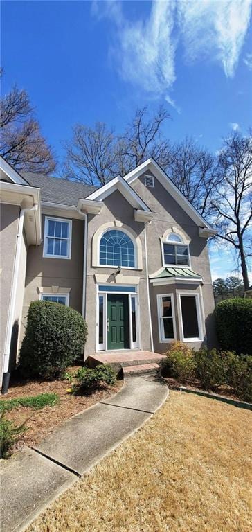 view of front of home featuring stucco siding