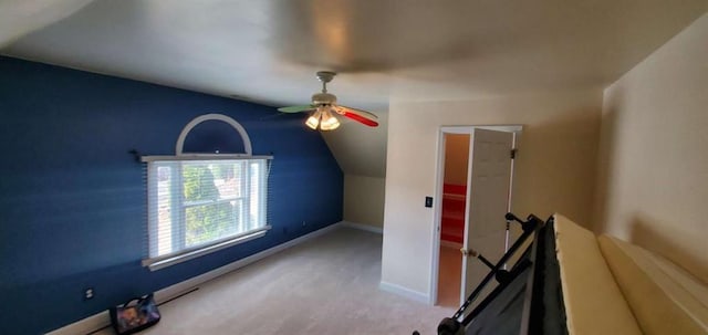 bonus room featuring carpet, vaulted ceiling, baseboards, and ceiling fan