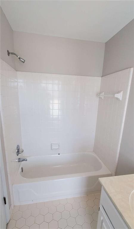 bathroom featuring shower / tub combination and vanity