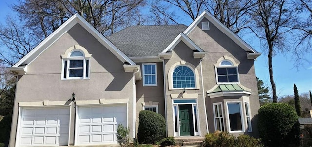 traditional home featuring an attached garage, driveway, roof with shingles, and stucco siding