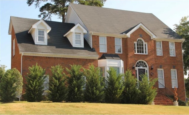 6868 Wynbrooke Cv, Stone Mountain, GA 30087 - view of front facade with brick siding and a front lawn