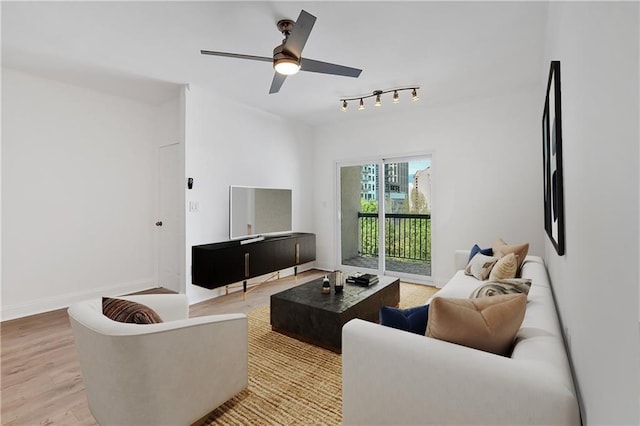 1075 Peachtree Walk NE Unit A421, Atlanta, GA 30309 - living area featuring light wood-type flooring, a ceiling fan, rail lighting, and baseboards