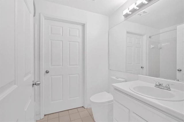 1075 Peachtree Walk NE Unit A421, Atlanta, GA 30309 - full bathroom with tile patterned floors, vanity, toilet, and a shower