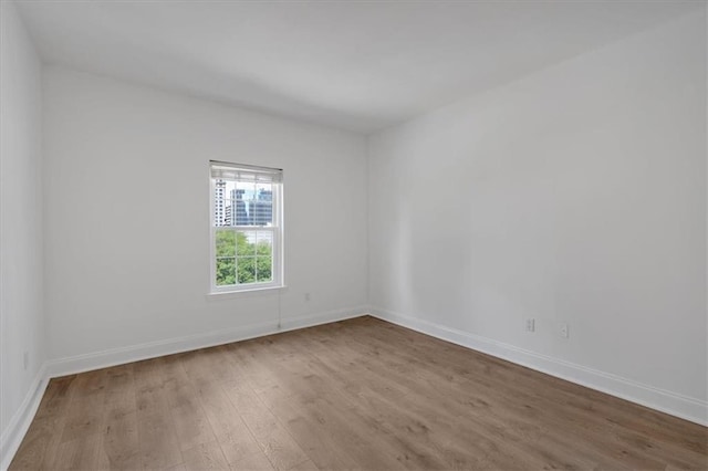 1075 Peachtree Walk NE Unit A421, Atlanta, GA 30309 - spare room featuring wood finished floors and baseboards