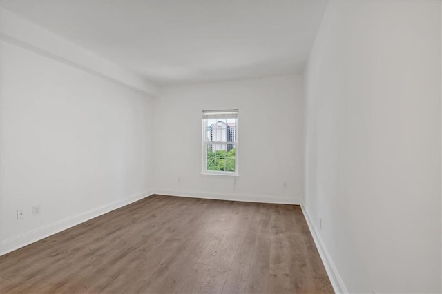 1075 Peachtree Walk NE Unit A421, Atlanta, GA 30309 - unfurnished room with wood finished floors and baseboards