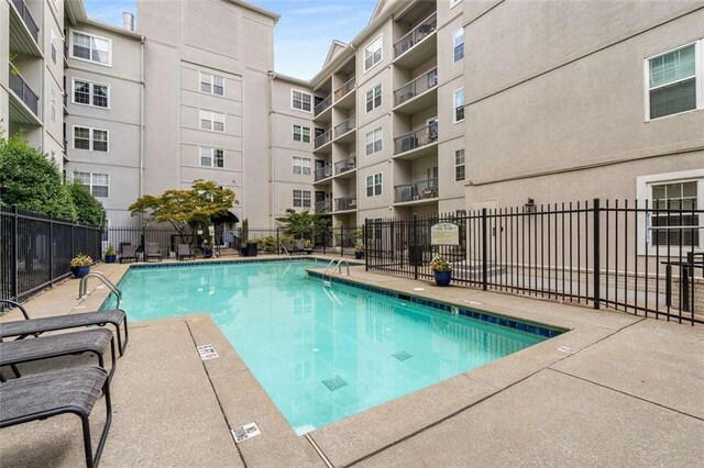 1075 Peachtree Walk NE Unit A421, Atlanta, GA 30309 - community pool with fence