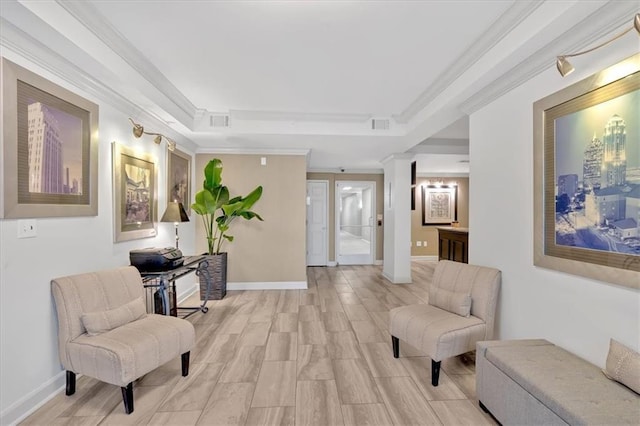 1075 Peachtree Walk NE Unit A421, Atlanta, GA 30309 - living area featuring ornamental molding, a tray ceiling, light wood-style flooring, ornate columns, and baseboards