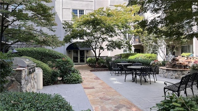 1075 Peachtree Walk NE Unit A421, Atlanta, GA 30309 - view of community with outdoor dining area, area for grilling, and a patio