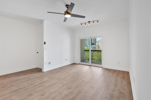 1075 Peachtree Walk NE Unit A421, Atlanta, GA 30309 - empty room featuring wood finished floors, ceiling fan, baseboards, and track lighting