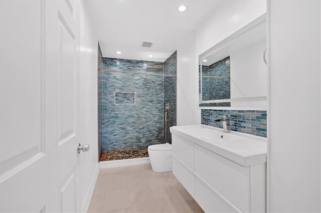 1075 Peachtree Walk NE Unit A421, Atlanta, GA 30309 - full bathroom featuring toilet, vanity, a stall shower, recessed lighting, and backsplash