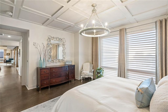 bedroom with a chandelier, beam ceiling, dark hardwood / wood-style flooring, and coffered ceiling