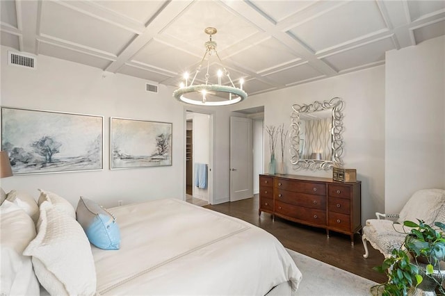 bedroom featuring dark hardwood / wood-style flooring, beamed ceiling, a chandelier, and coffered ceiling