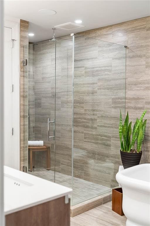 bathroom with vanity and an enclosed shower