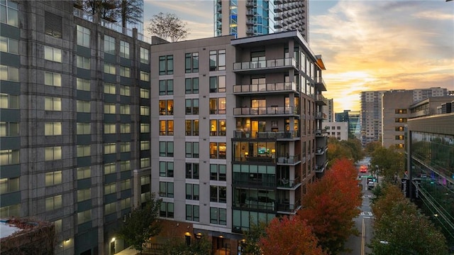 view of outdoor building at dusk