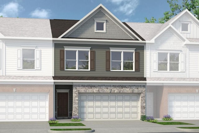 townhome / multi-family property featuring a garage