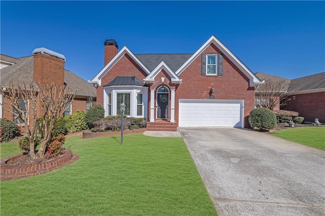 traditional-style house with brick siding, a chimney, a front yard, a garage, and driveway