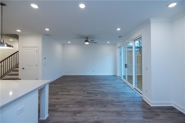 kitchen with decorative light fixtures, ceiling fan, crown molding, and dark hardwood / wood-style floors