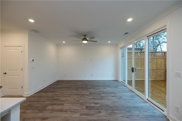 spare room featuring ornamental molding, ceiling fan, and dark hardwood / wood-style floors