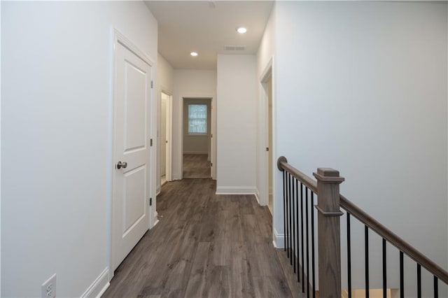 corridor featuring dark wood-type flooring