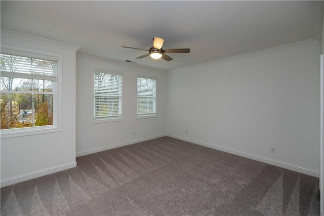 carpeted empty room with ceiling fan and crown molding