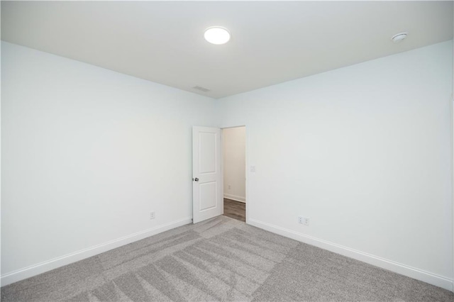 unfurnished room featuring carpet flooring